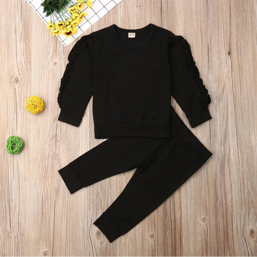 Baby two-piece outfit set with cotton long-sleeve ruffle sweatshirt and pants in solid colour, available in black, brown, wine red