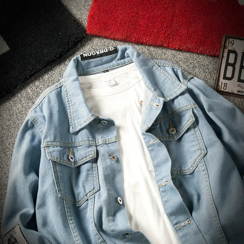 Blue loose-fit denim jacket with lapel collar and multiple pockets