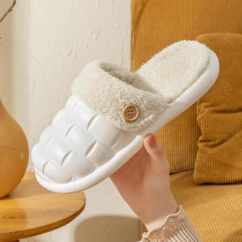 Plaid detachable slippers for women with plush lining and EVA sole in pink, shown on a wooden floor.