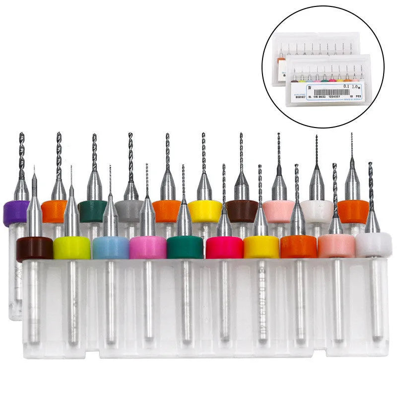 Ten tungsten carbide PCB drill bits with straight shanks on a white background