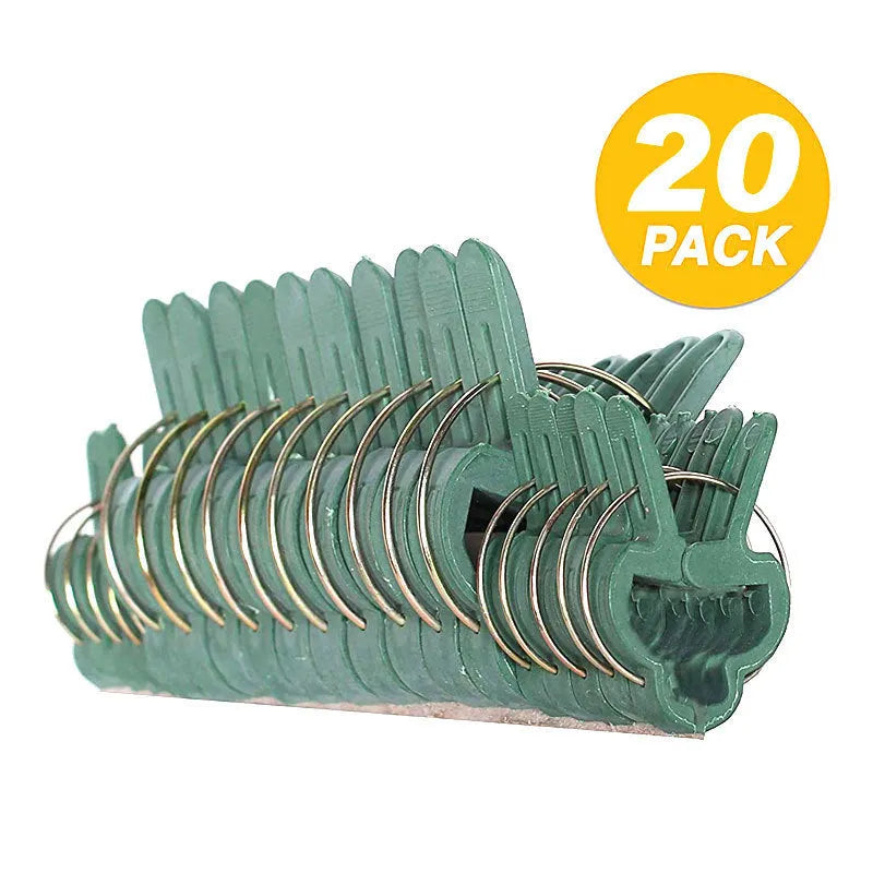 Green plastic and zinc plant fixing clips, showing large and small sizes for garden vine support.