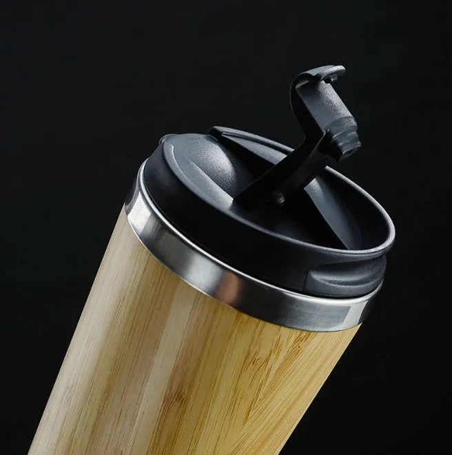 Bamboo coffee cup with thermal insulation, leak-proof lid, and anti-slip foam pad base showing 420ml capacity