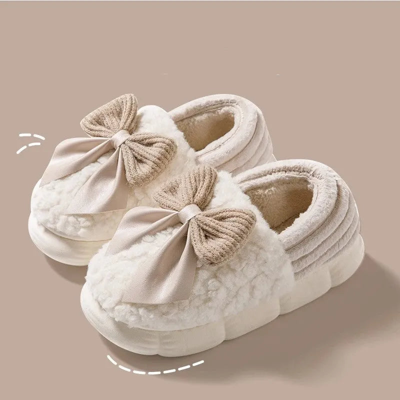 Big bow-knot fluffy slippers with covered heel in pink colour on floor