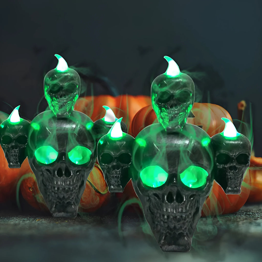 Halloween skull ornament with LED light, gold and silver, plastic, 14x12x9cm, on dark background