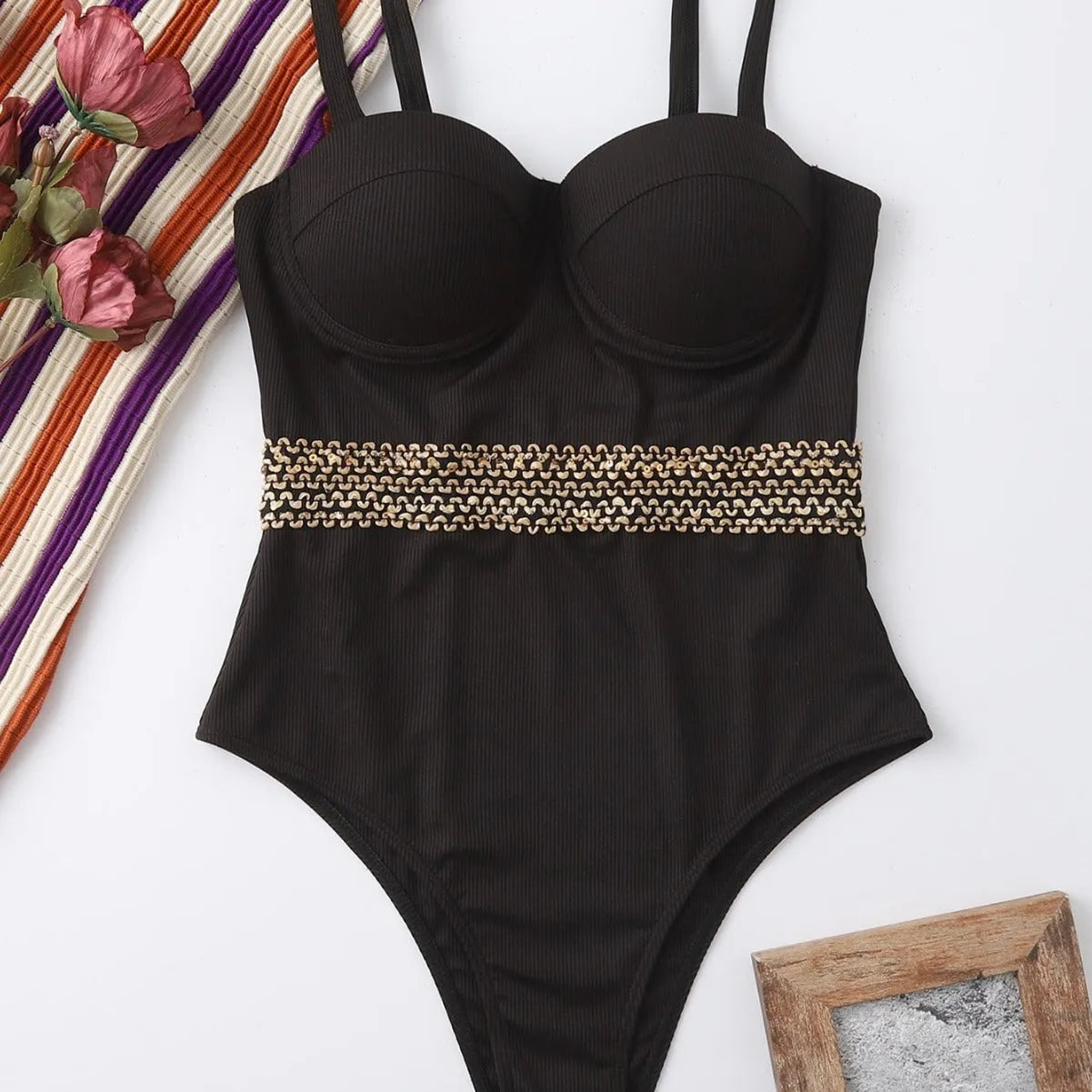 Black one-piece swimsuit for women with adjustable shoulder straps shown on mannequin