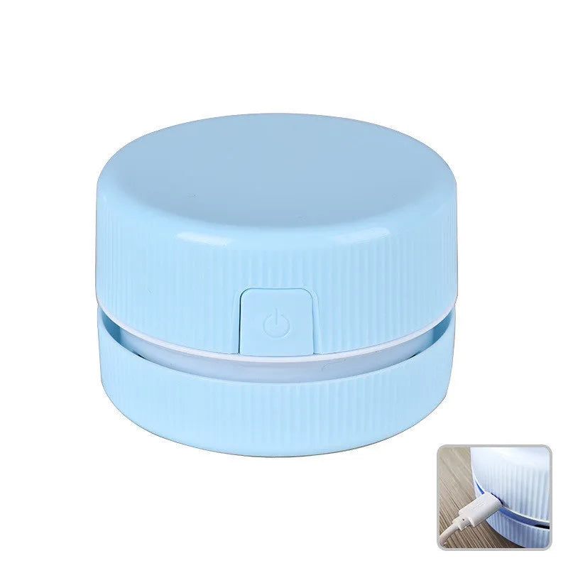Portable mini desktop vacuum cleaner in blue colour with handheld design