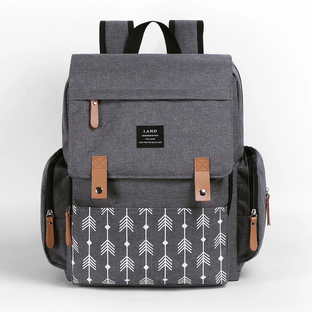 Land Mommy large oxford cloth diaper backpack in grey with a changing mat, shown open.