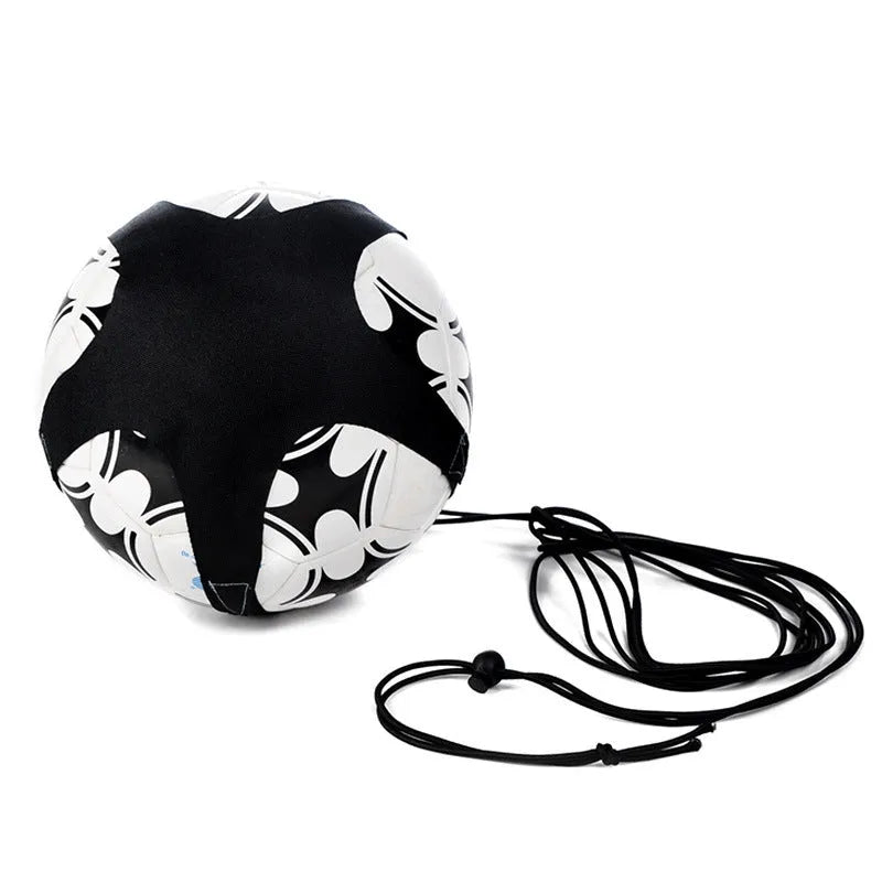Black soccer training tether with adjustable waist belt and elastic Velcro strap on a green grass field