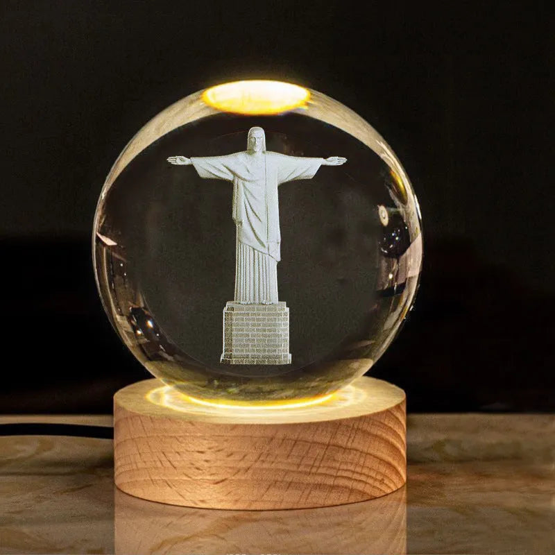White crystal ball desk ornament with wood base and religious design inside