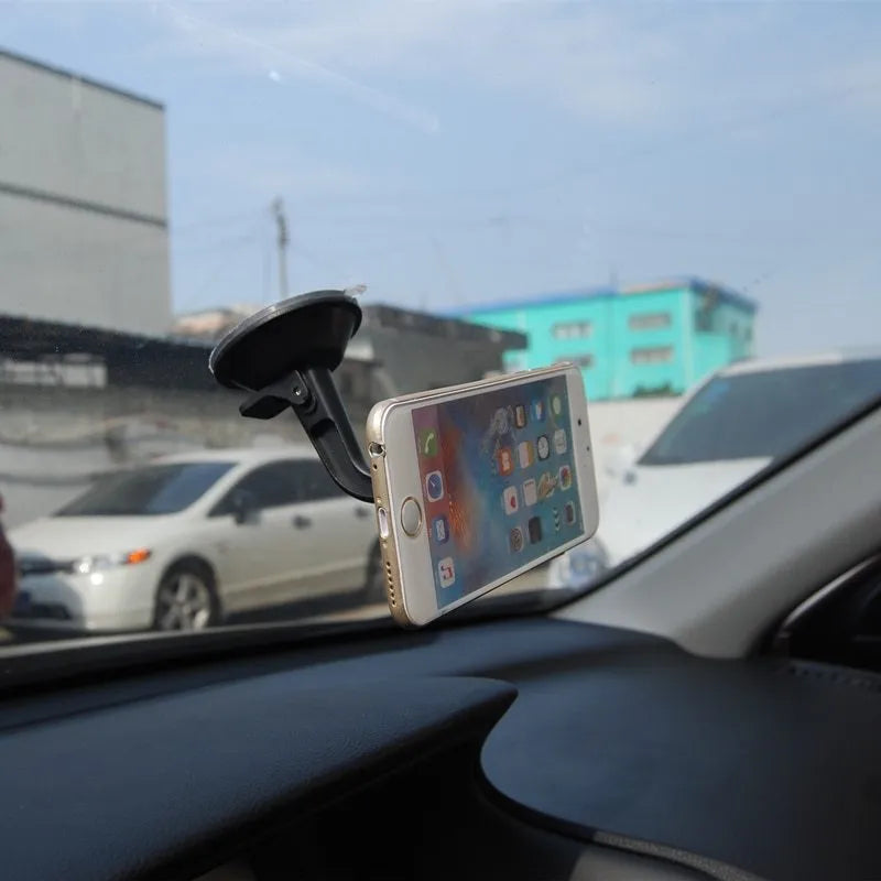 Black magnetic car phone holder with 360 rotation for dashboard mounting with iPhone and Samsung compatibility