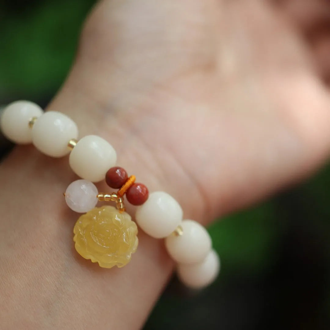 Gradient white jade Bodhi root bracelet with natural beeswax lotus charms, 10mm flower shape