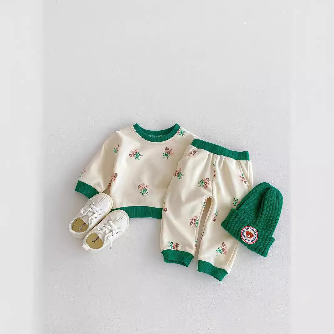 Baby cotton suit set in green with long sleeves and pants, front view