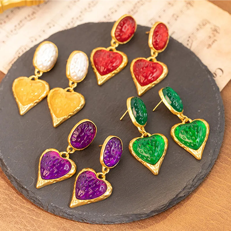 Pleated oval love heart stud earrings in purple, red, green, and yellow white colours with butterfly backs