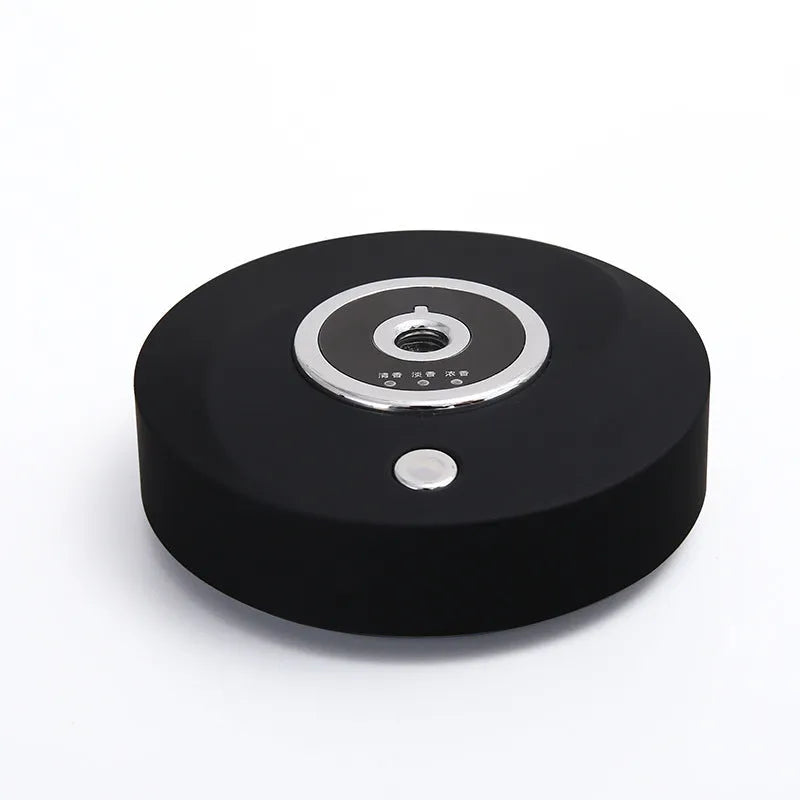 White, grey, and black USB car aromatherapy diffuser with anti-slip pad for dashboard mounting.