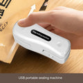 Milky white portable kitchen sealer with USB charging cable and compact dimensions