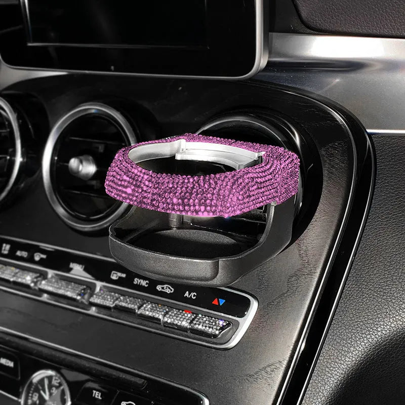 White diamond encrusted ABS plastic car cup holder mounted on a vehicle air vent.