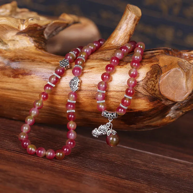 Watermelon crystal bracelet with Chinese knot closure and elephant bead design