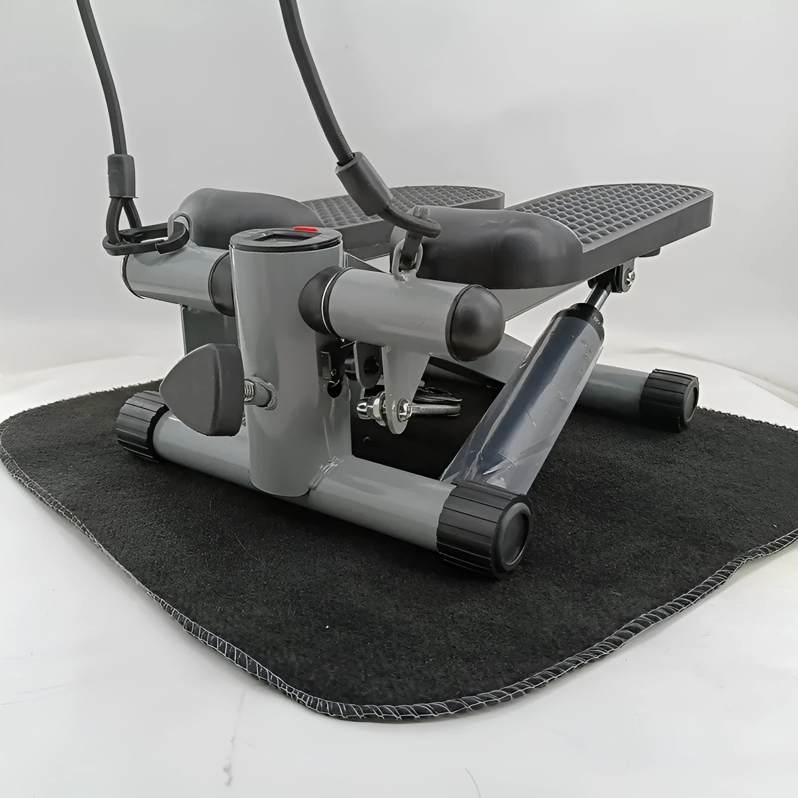Silver grey hydraulic mini treadmill for waist slimming and home workouts.