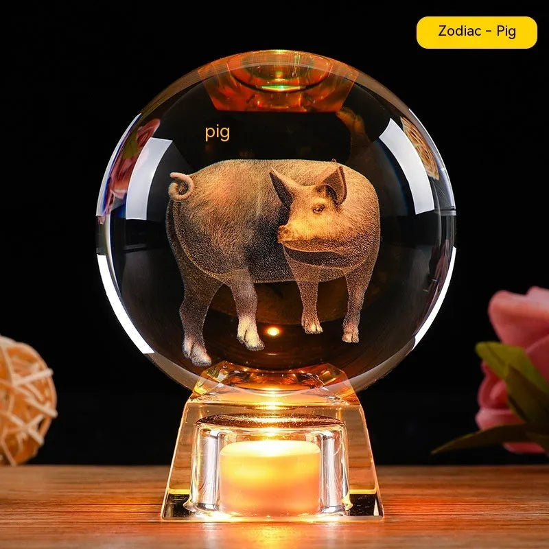 White crystal ball zodiac ornament with luminous electronic base showing Chinese animal designs