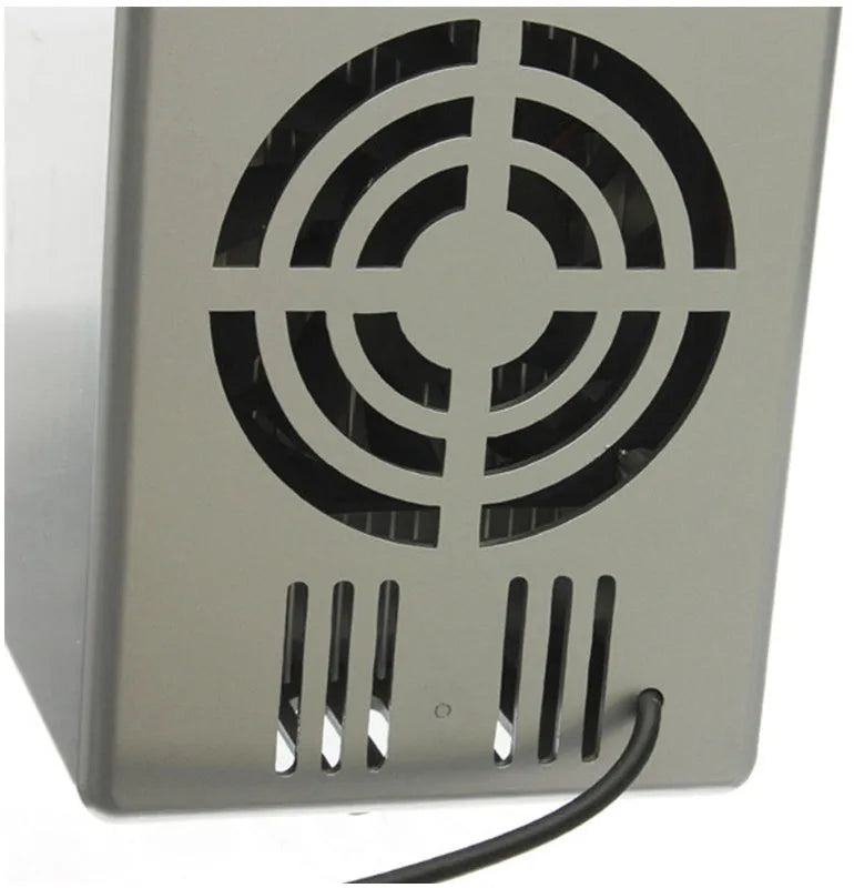 Silver USB mini fridge with open door showing two beverage cans and interior LED light