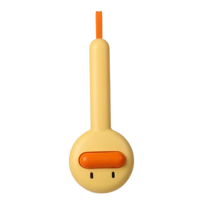 Small yellow duck-shaped pet grooming comb with open-section needle brush design for cat and dog hair removal