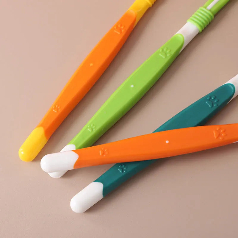 Pet toothbrush with nylon bristles and plastic handle in green colour