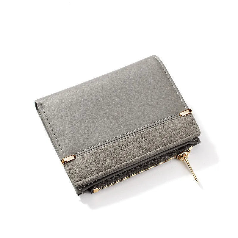 Ladies foldable wallet with zip closure showing multiple internal card slots and compartments