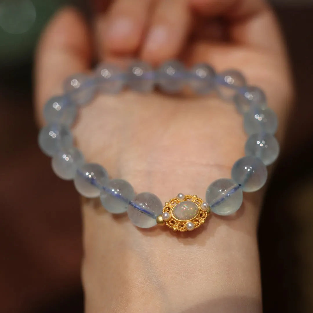 Aquamarine gemstone and components for a DIY Fengjiu Chinese style bracelet kit for women.