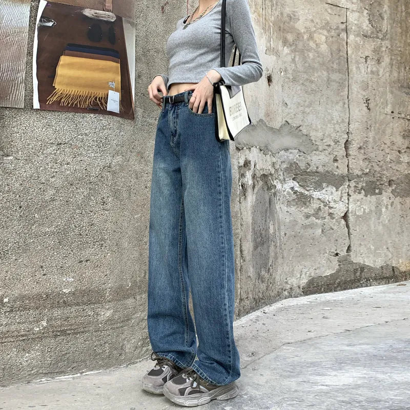 A pair of women's high waist straight leg jeans in retro blue cotton denim.