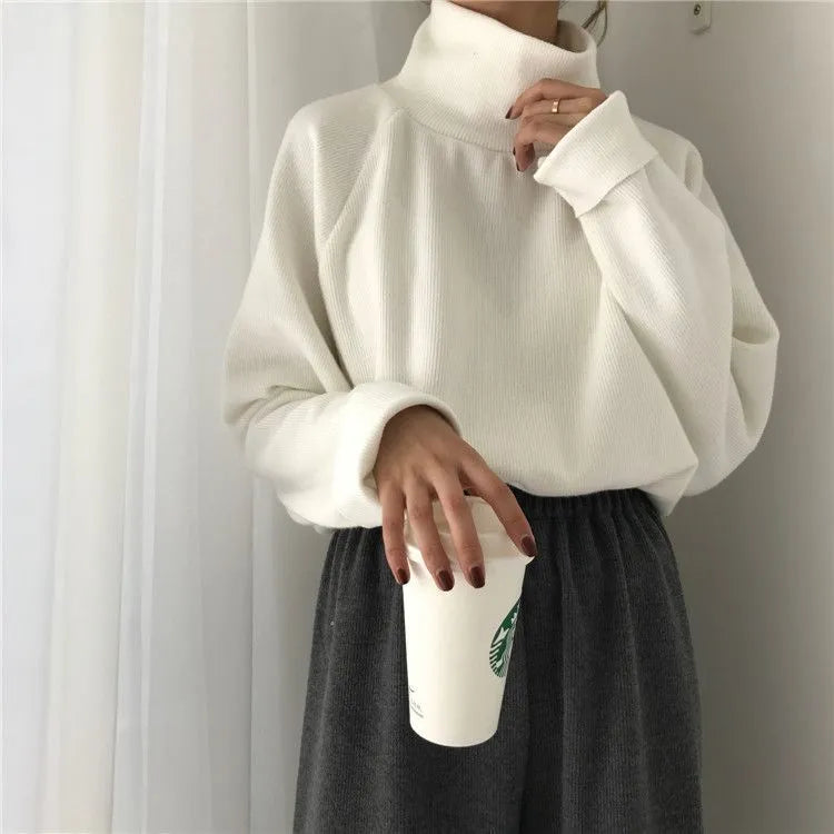 Women's loose fit long sleeve polyester top with half-high collar in solid apricot colour