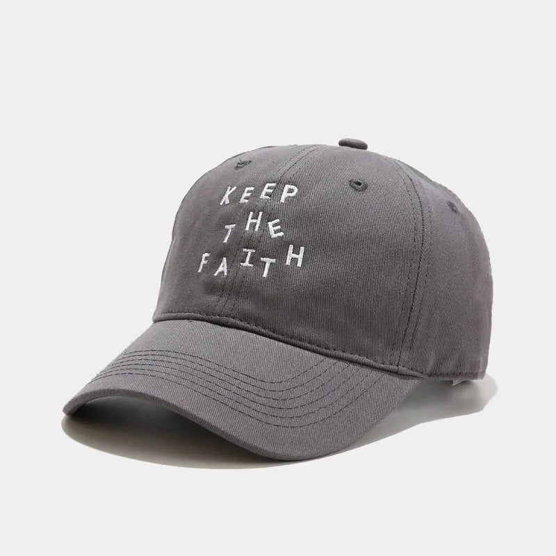 Men's beige cotton baseball cap with adjustable strap and dome crown on a white background.