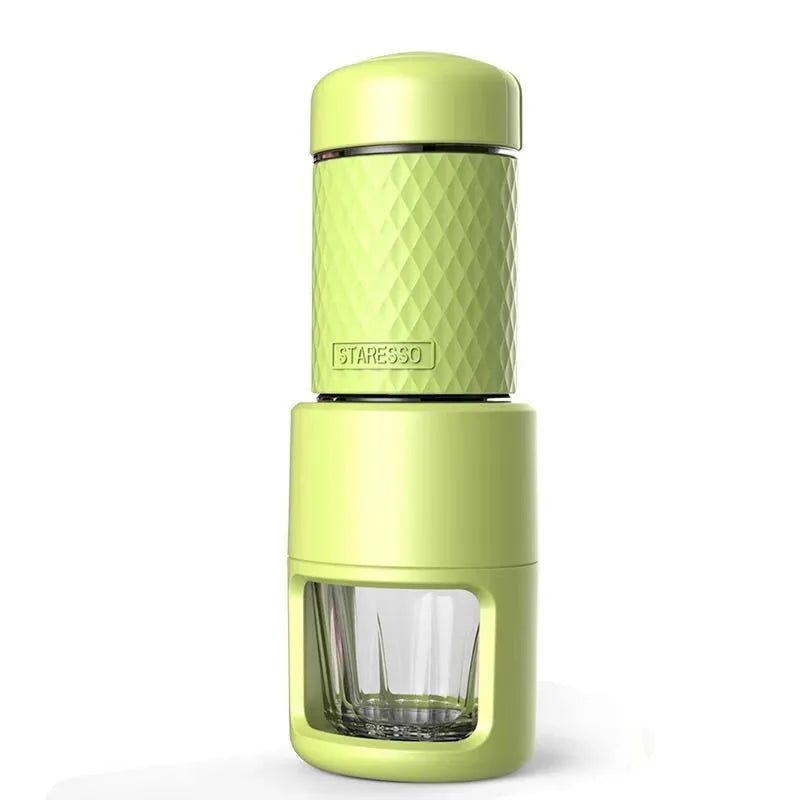 Portable manual espresso coffee machine in four colours with compact stainless steel design.