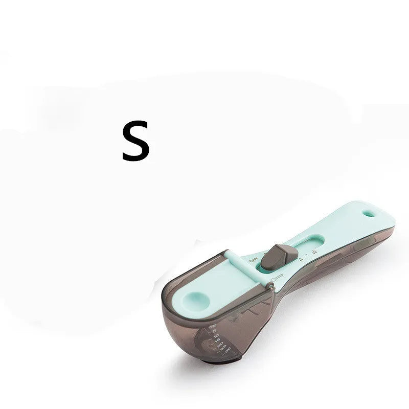 Two magnetically nested digital measuring spoons in blue and orange on a kitchen surface