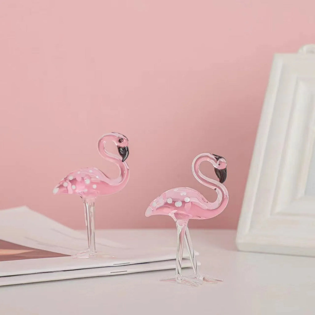 Pink and white crystal flamingo decorative ornament on a table, showing modern simple style.
