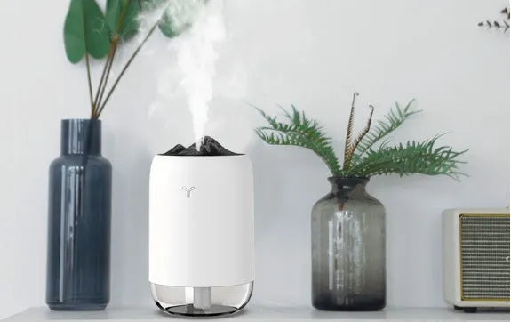 Mini cylindrical USB humidifier in green, pink, or white with 260ml water tank
