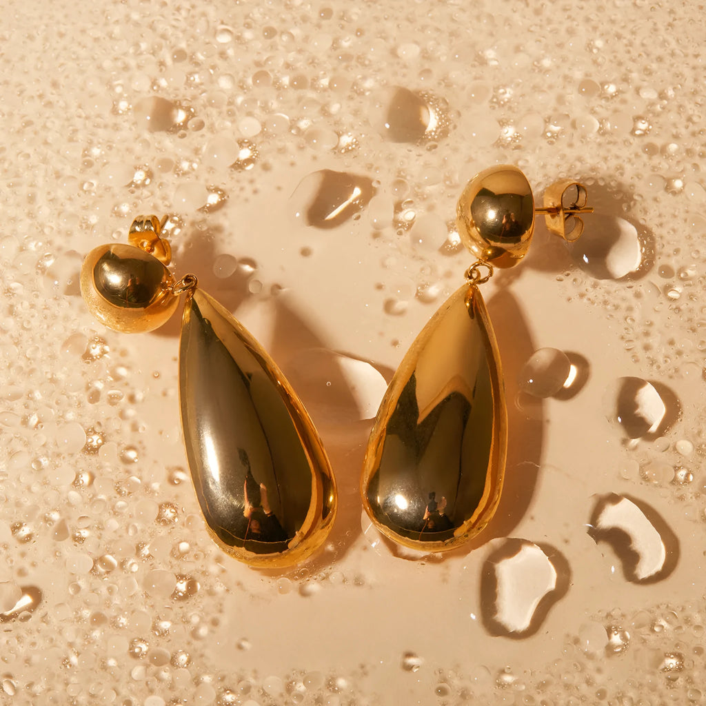 Gold stainless steel water drop pendant earrings with geometric hemisphere design elements