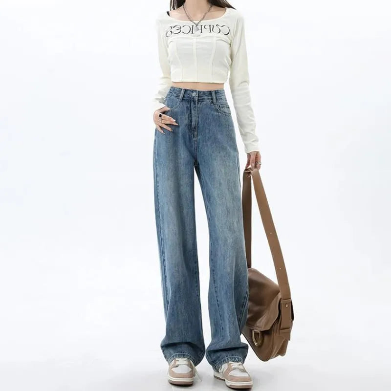 Women's retro blue high-waist wide leg jeans laid flat, showing the straight-leg trousers cut.