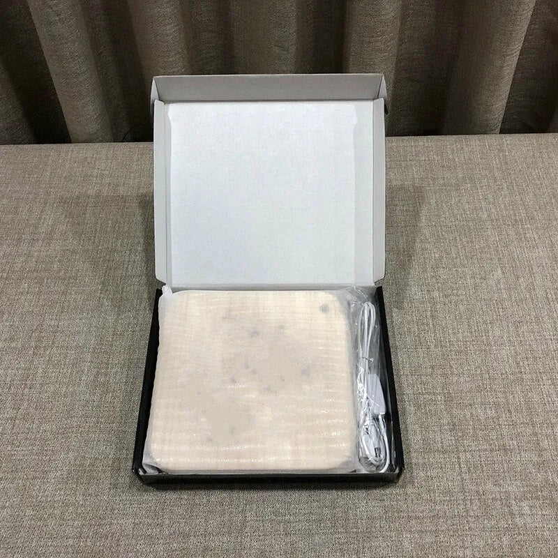 Square pine wood USB LED atmosphere lamp emitting warm white light on a table.