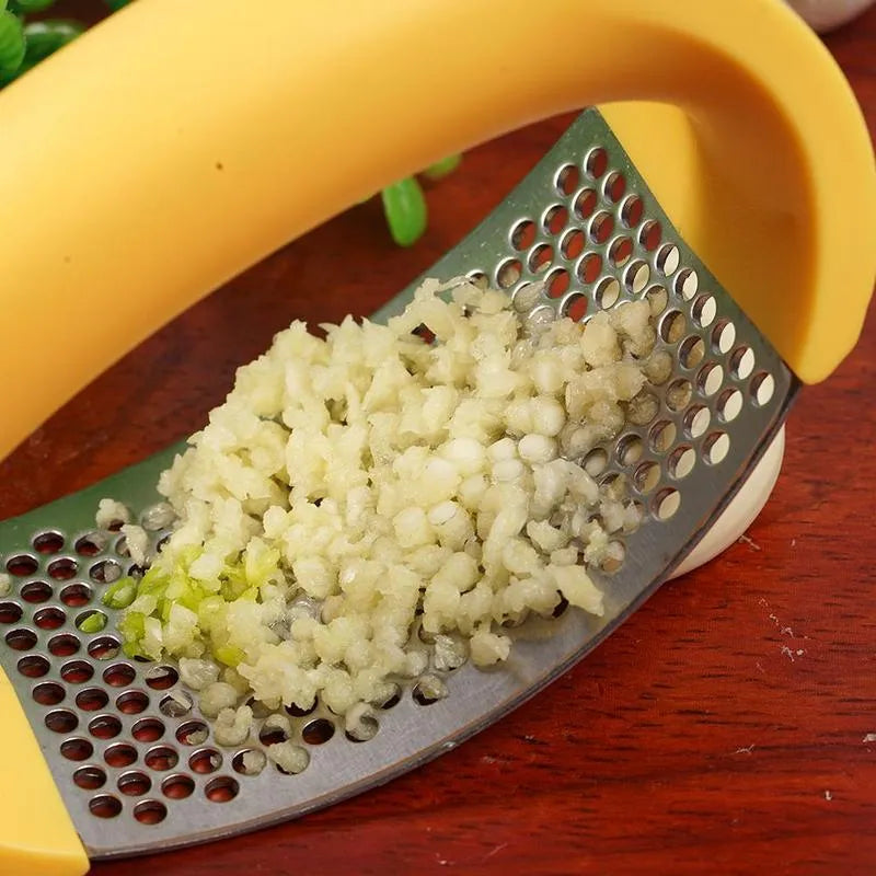 Stainless steel garlic masher press with ergonomic handle and non-slip grip