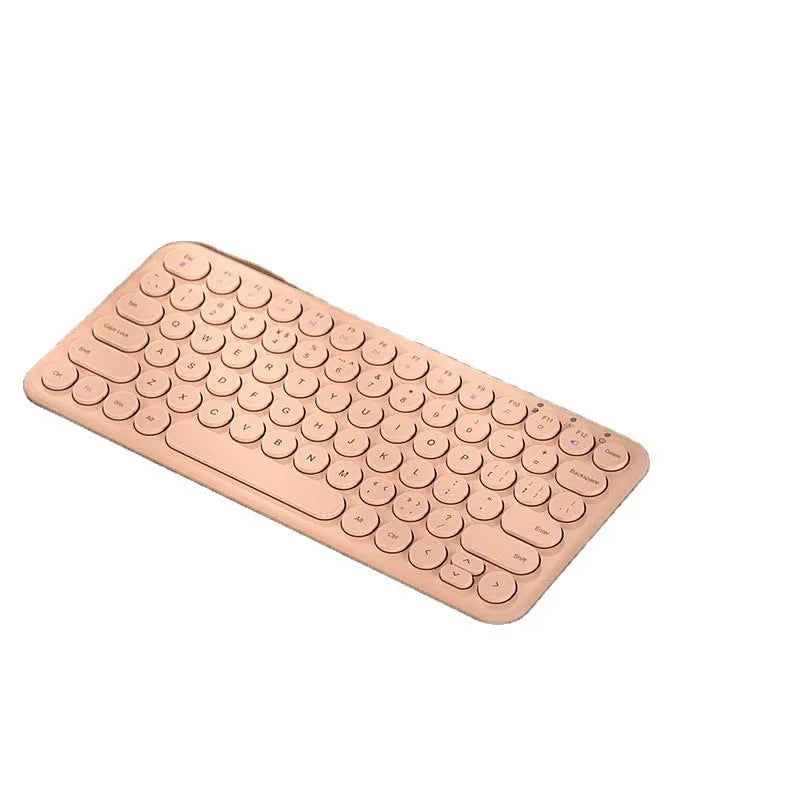 Ultra-thin white wireless keyboard and mouse set with USB dongle on a wooden desk.
