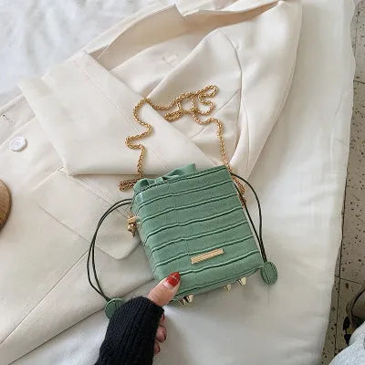 Korean-style small black PU bucket bag with a silver chain strap, shown open.