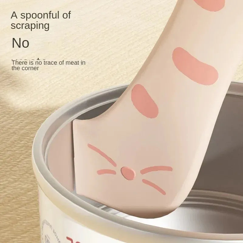 Silicone pet food mixing spoon and flexible can sealing lids in grey, pink and yellow colours.