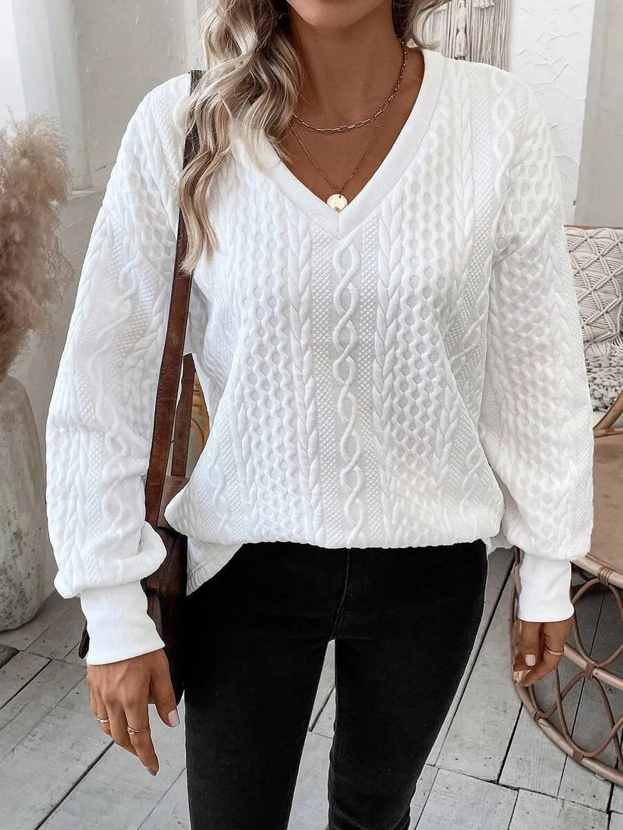 Milky white loose fit long sleeve T-shirt with a raised 3D pattern on the front.