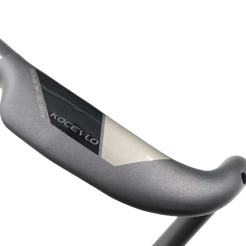 Matt black carbon fibre road bicycle handlebar shown from above, with bent drops.