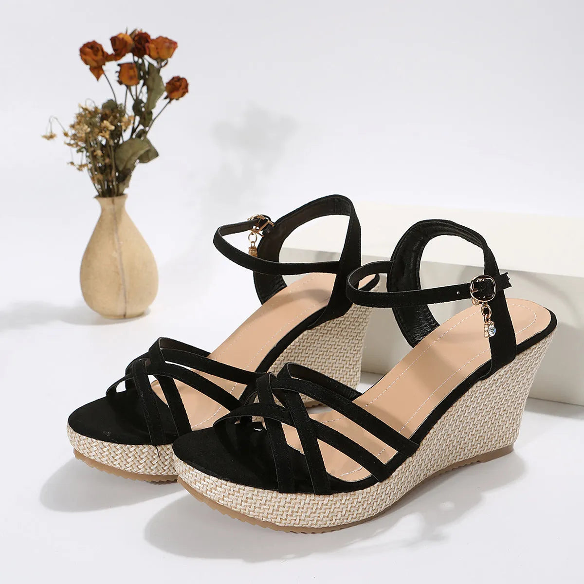 Women's simple wedge sandals with fish mouth toe in black and milky white on a neutral background.
