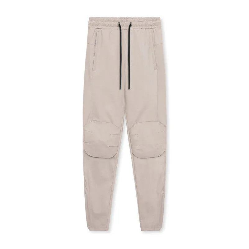 Men's loose grey running pants with ankle ties, quick-drying polyester fitness trousers for exercise