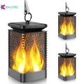 Set of four black solar-powered flame effect LED lanterns for outdoor garden decoration.