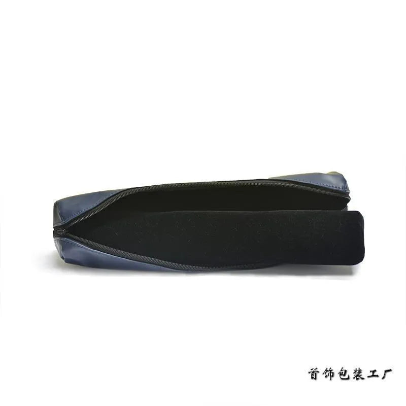 Portable bracelet watch storage bag in black leather with black bracelet stick on a flat surface