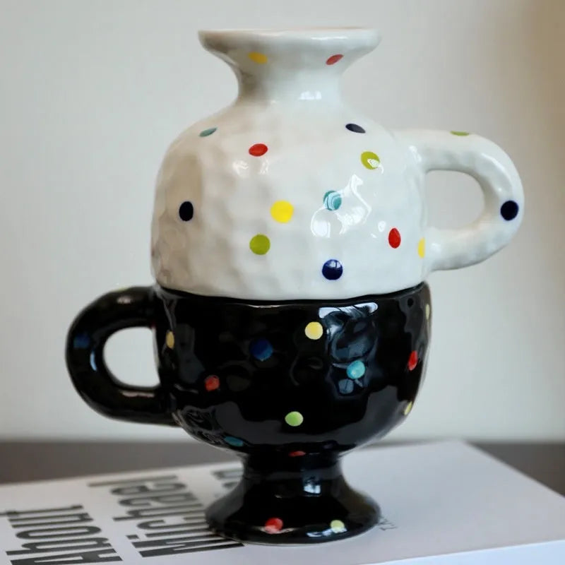 Hand-pinched irregular ceramic mug showing solid colour and unique shape