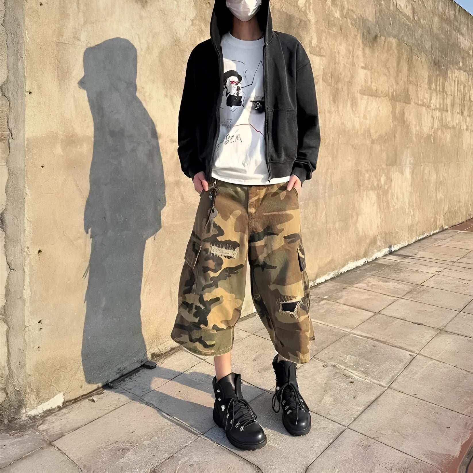 Men's camouflage cropped jeans with patch ripped detailing and loose straight-leg cut
